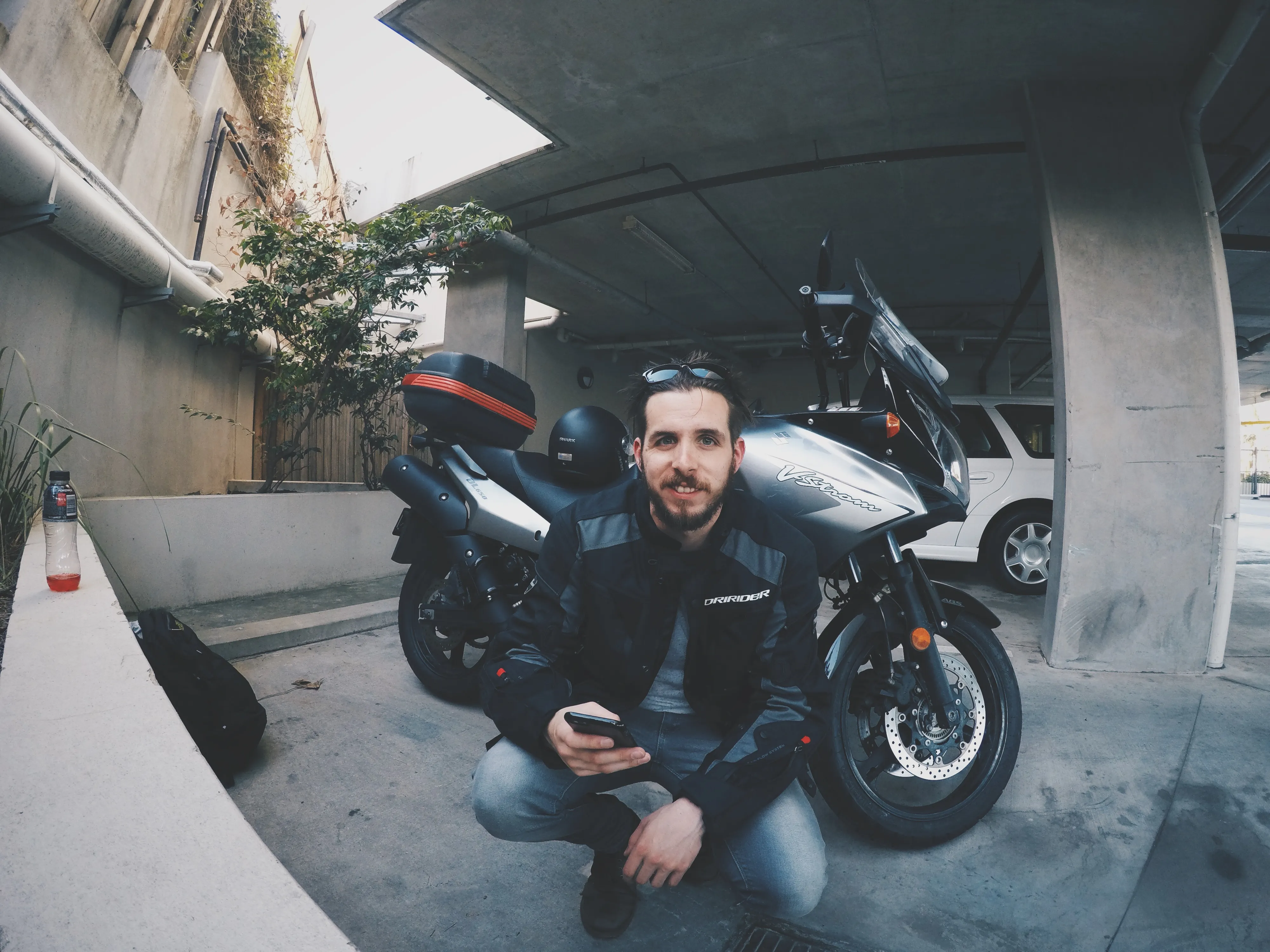 Jamie, picture in front of motorbike before setting off from Brisbane.